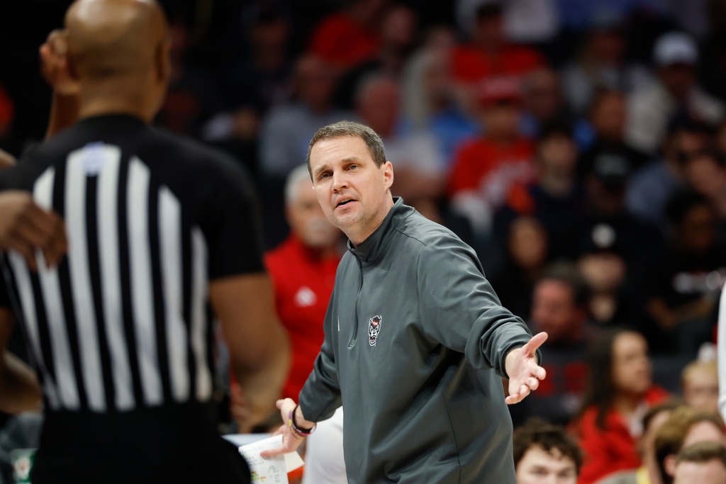 North Carolina State head coach Will Wade questions a call during the first half of an NCAA college basketball game against Virginia in the quarterfinals of the Atlantic Coast Conference tournament in Charlotte, N.C., Thursday, March 12, 2026. (AP Photo/Nell Redmond)