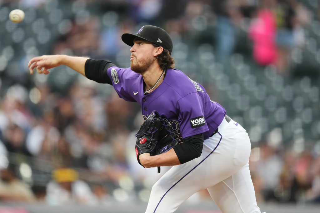 Colorado Rockies relief pitcher Chase Dollander works against the San Diego Padres in the second inning of a baseball game Tuesday, April 21, 2026, in Denver. (AP Photo/David Zalubowski)