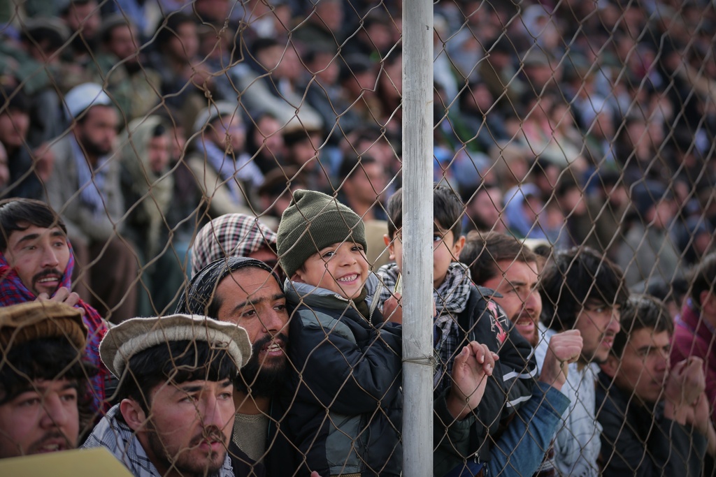 Afghan men and boys attend the final of Afghanistan's annual buzkashi tournament, a traditional equestrian sport in which riders compete to score points using a fake goat carcass, on the outskirts of Kabul, Afghanistan, Monday, Dec. 22, 2025. (AP Photo)