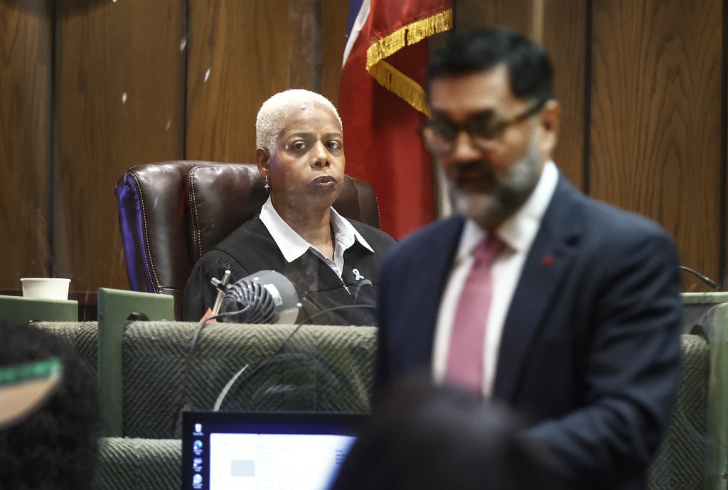 Shelby County Judge Jennifer Mitchell, left, listens to opening statement during the murder trial Hernandez Govan, who is accused of orchestrating the killing of rapper Young Dolph in Memphis, Tenn., on Monday, Aug. 18, 2025. (Mark Weber/Daily Memphian via AP, Pool)