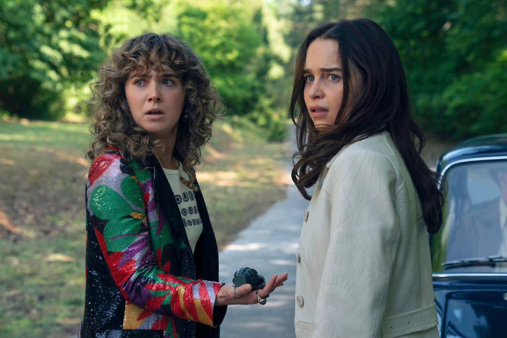 This image released by Peacock shows Haley Lu Richardson, left, and Emilia Clarke in a scene from "Ponies." (Katalin Vermes/Peacock via AP)