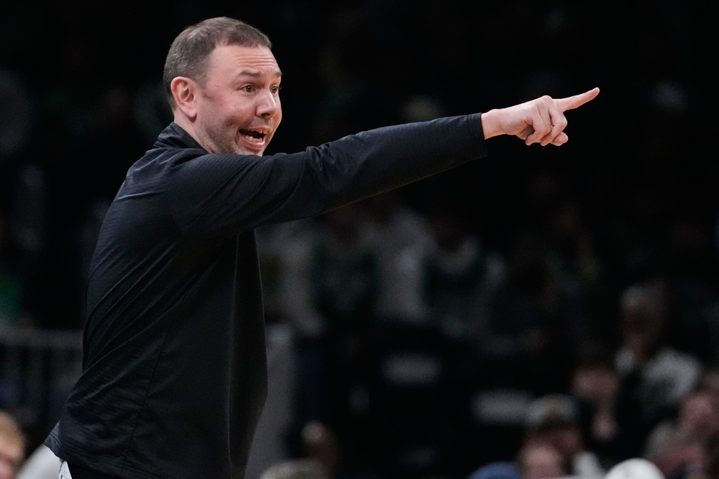 Denver Nuggets head coach David Adelman calls to his players during the first half of an NBA basketball game against the Boston Celtics, Wednesday, Jan. 7, 2026, in Boston. (AP Photo/Charles Krupa)