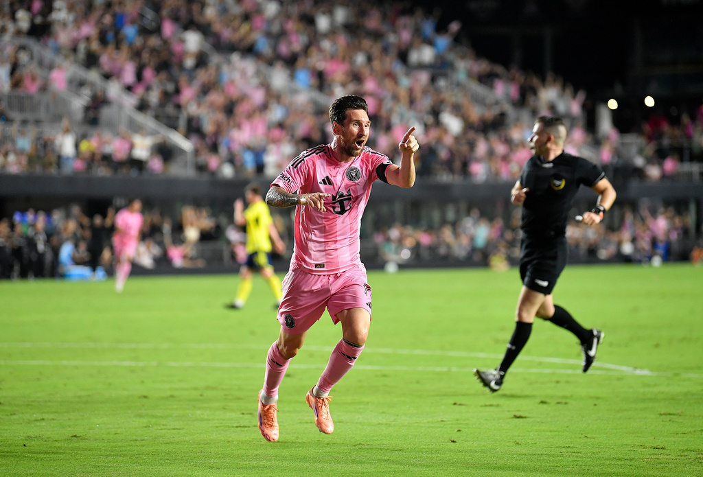 Inter Miami forward Lionel Messi, left, points to teammate Mateo Silvetti (not shown) after scoring during the first half of Game 3 in the first round of MLS soccer's Western Conference playoffs against Nashville SC in Fort Lauderdale, Fla., Nov. 8, 2025. (AP Photo/Michael Laughlin)