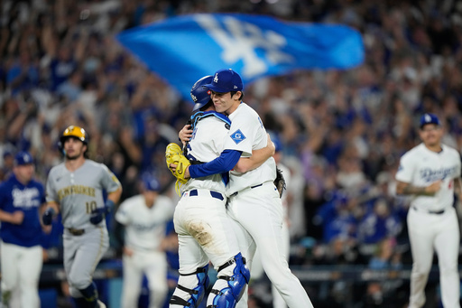 Los Angeles Dodgers pitcher Roki Sasaki and catcher Will Smith celebrates their win against the Milwaukee Brewers in Game 4 of baseball's National League Championship Series, Friday, Oct. 17, 2025, in Los Angeles. (AP Photo/Brynn Anderson) Los Angeles Dodgers pitcher Roki Sasaki and catcher Will Smith celebrates their win against the Milwaukee Brewers in Game 4 of baseball's National League Championship Series, Friday, Oct. 17, 2025, in Los Angeles. (AP Photo/Brynn Anderson)