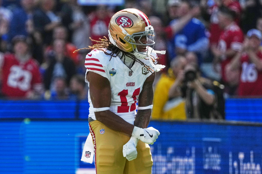 San Francisco 49ers wide receiver Demarcus Robinson celebrates after scoring against the Los Angeles Rams during the first half of an NFL football game, Friday, Sept. 11, 2026, in Melbourne, Australia. (AP Photo/Scott Barbour)