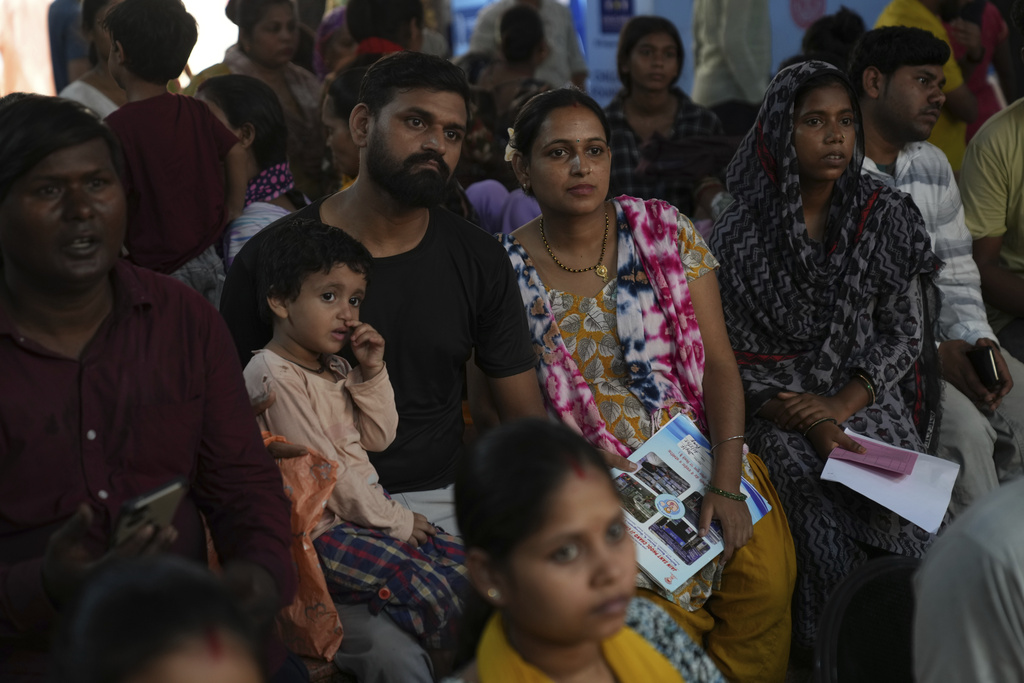 Rajkumar Varma, center, left, and his pregnant wife Anju Varma participats in an antenatal Care Companion Program (CCP) at a government hospital in Gurugram, a satellite city of New Delhi, India, on Aug. 7, 2025. (AP Photo/Manish Swarup)