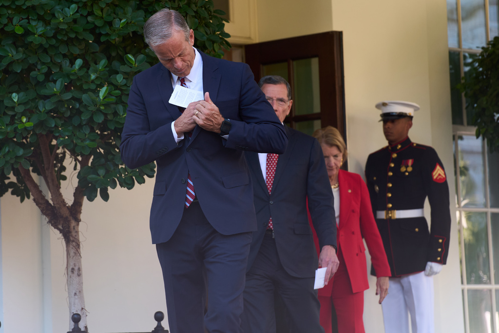 Senate Majority Leader John Thune, of S.D., walks out of the White House after meeting with President Donald Trump about the government shutdown, Tuesday, Oct. 21, 2025, in Washington. (AP Photo/Evan Vucci)