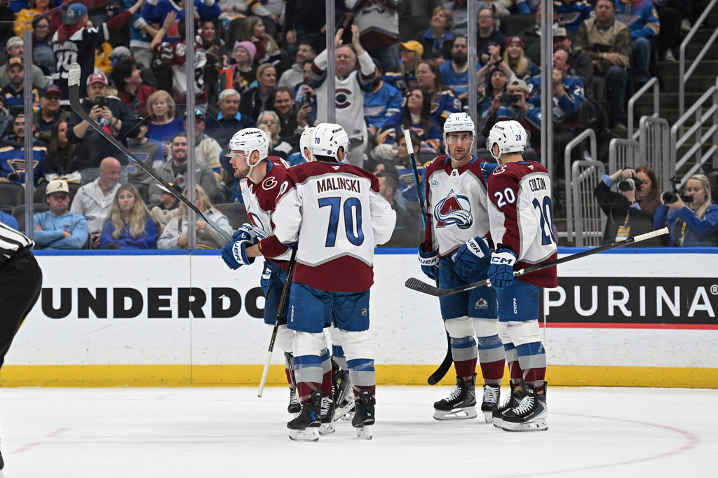 Colorado Avalanche's Valeri Nichushkin, left, is congratulated after scoring against the St. Louis Blues during the first period of an NHL hockey game, Tuesday, April 7, 2026, in St. Louis. (AP Photo/Joe Puetz)
