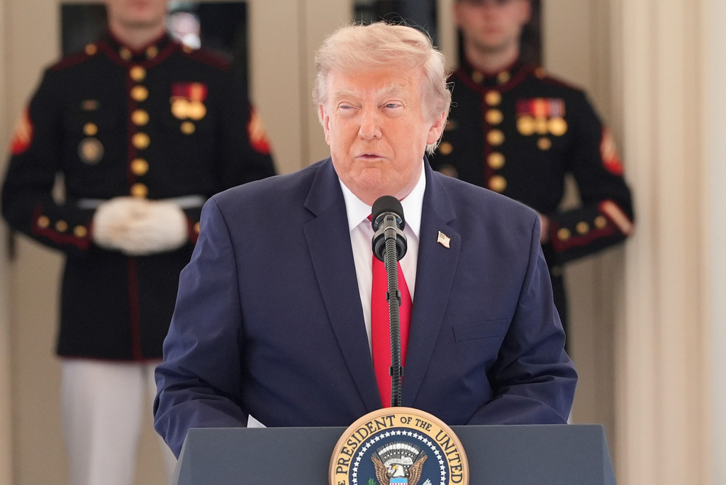 President Donald Trump speaks on West Executive Drive at the White House during a showcase for the upcoming Freedom 250 Grand Prix auto race, Monday, July 13, 2026, in Washington. (AP Photo/Alex Brandon)