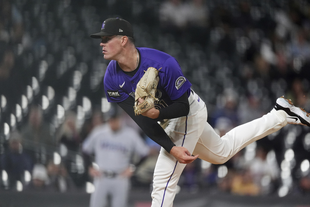 Colorado Rockies starting pitcher McCade Brown works against the Miami Marlins in the first inning of a baseball game Wednesday, Sept. 17, 2025, in Denver. (AP Photo/David Zalubowski)