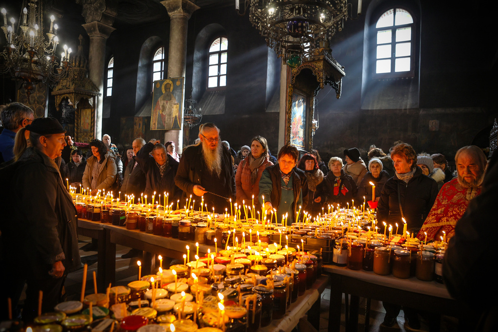 Believers attend an Orthodox service for the “sanctification of honey,” at the Presentation of the Blessed Virgin Church in the town of Blagoevgrad, Bulgaria, Tuesday, Feb.10, 2026, marking the feast day of St. Haralambos, the Orthodox patron saint of beekeepers. (AP Photo/Valentina Petrova)