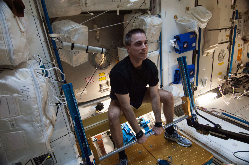 FILE - In this photo made available by NASA, astronaut Chris Cassidy, Expedition 36 flight engineer, exercises on the advanced Resistive Exercise Device (aRED) in the Tranquility node of the International Space Station on Aug. 31, 2013. (NASA via AP, File)