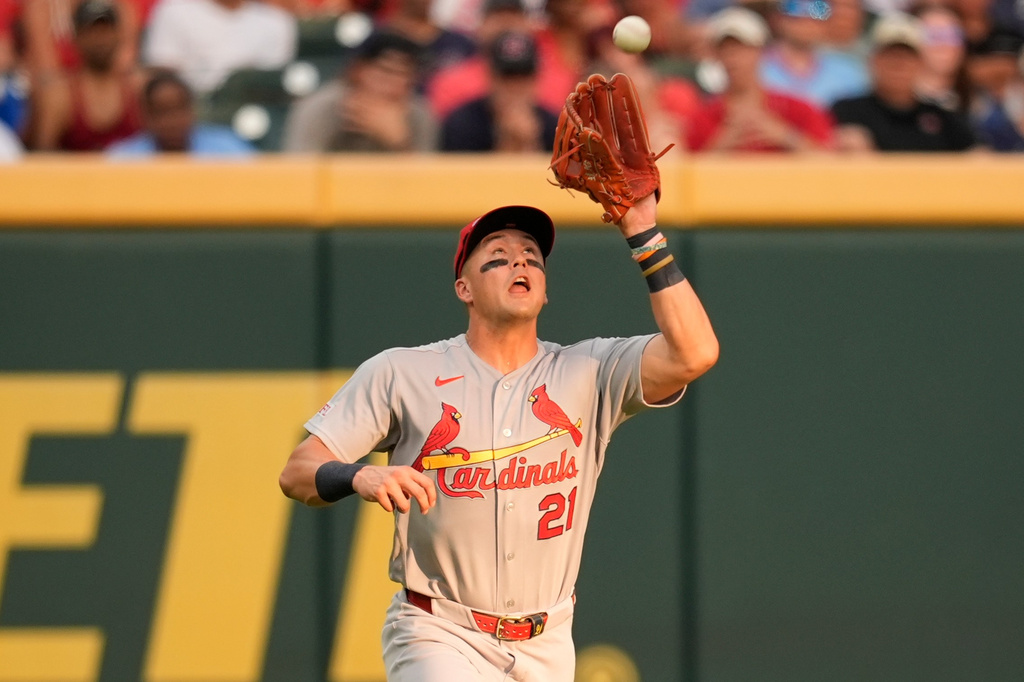 St. Louis Cardinals left fielder Lars Nootbaar (21) makes the catch off the bat of Atlanta Braves' Ozzie Albies scoring Jorge Mateo in the third inning of a baseball game, Tuesday, June 30, 2026, in Atlanta. (AP Photo/Mike Stewart)