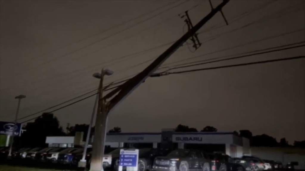 This grab from a video shot by WCPO-TV shows an electricity pole damaged by the storm, on Thursday, June 18, 2026, in Florence, Kentucky. (WCPO-TV via AP)