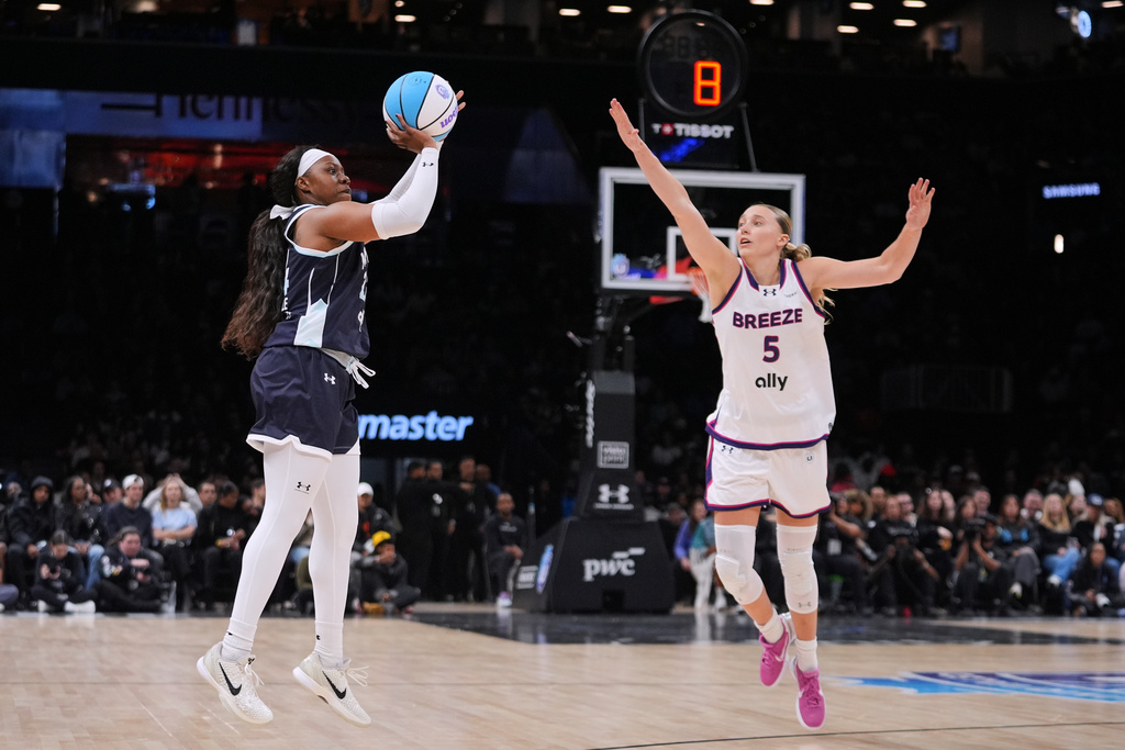 Mist BC wing Arike Ogunbowale (24) shoots over Breeze BC guard Paige Bueckers (5) during the second half of a semifinal in an Unrivaled 3-on-3 basketball game, Monday, March 2, 2026, in New York. (AP Photo/Frank Franklin II)