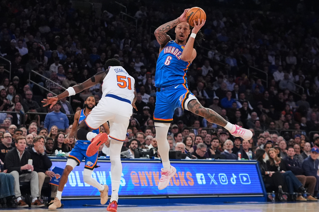 Oklahoma City Thunder's Jaylin Williams (6) fights for control of the ball with New York Knicks' Mohamed Diawara (51) during the first half of an NBA basketball game Wednesday, March 4, 2026, in New York. (AP Photo/Frank Franklin II)