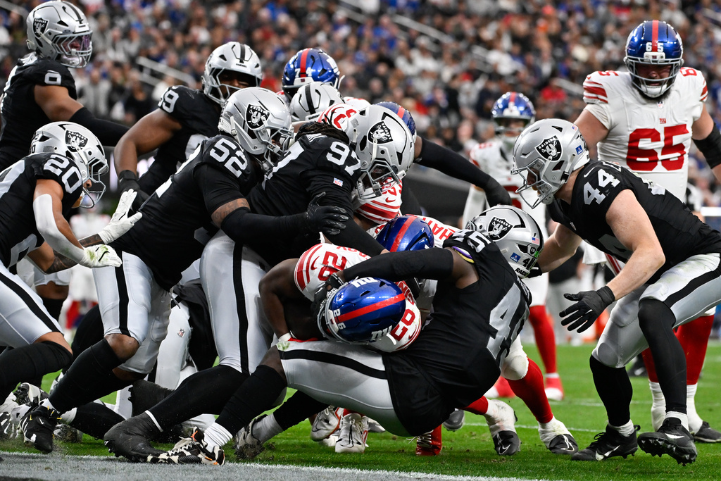 New York Giants running back Devin Singletary (26) scores touchdown against the Las Vegas Raiders during the first half of an NFL football game Sunday, Dec. 28, 2025, in Las Vegas. (AP Photo/David Becker)