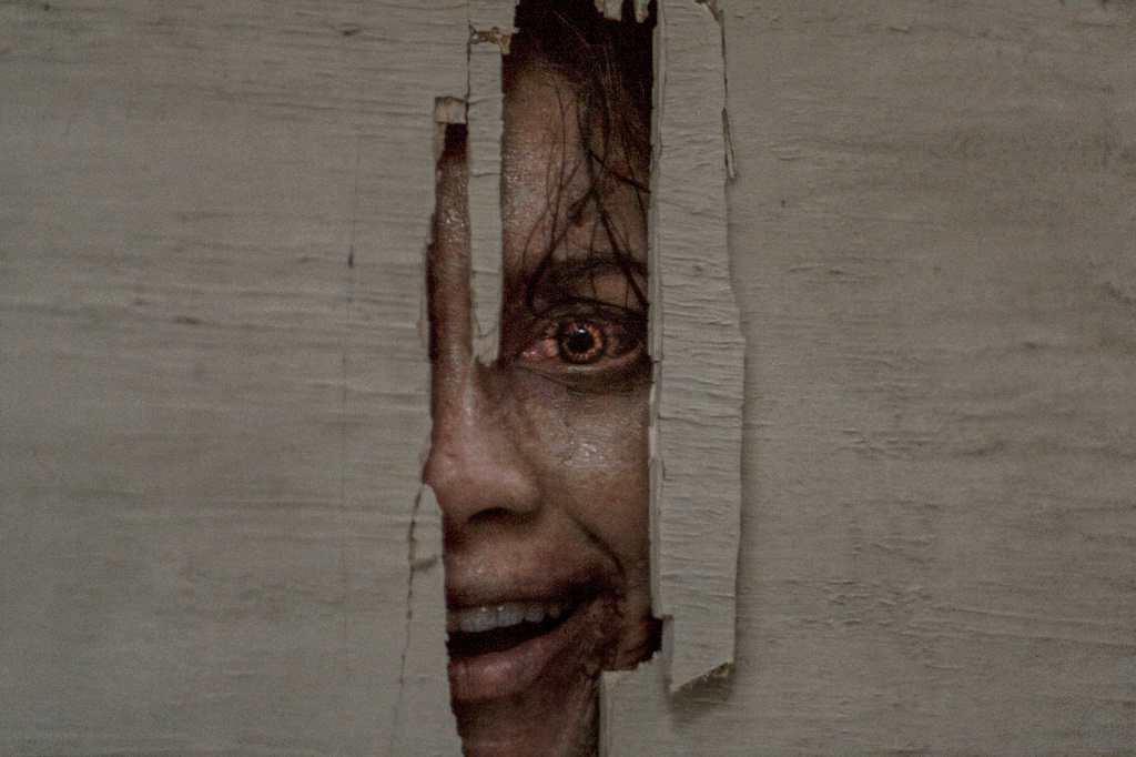 This image released by Warner Bros. Pictures shows Luciane Buchanan in a scene from "Evil Dead Burn." (Warner Bros. Pictures via AP)