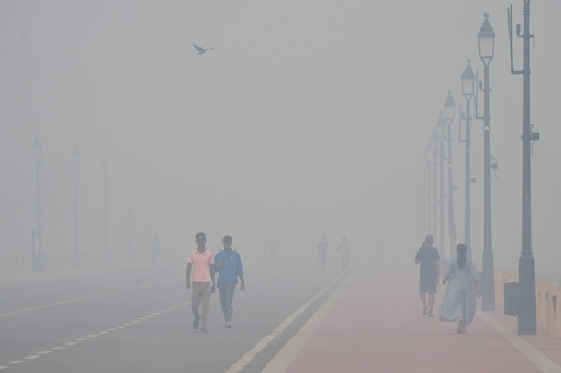 People walk in the morning near the India Gate monument amidst morning smog a day after Diwali festival in New Delhi, India, Tuesday, Oct. 21, 2025. (AP Photo/Manish Swarup) People walk in the morning near the India Gate monument amidst morning smog a day after Diwali festival in New Delhi, India, Tuesday, Oct. 21, 2025. (AP Photo/Manish Swarup)