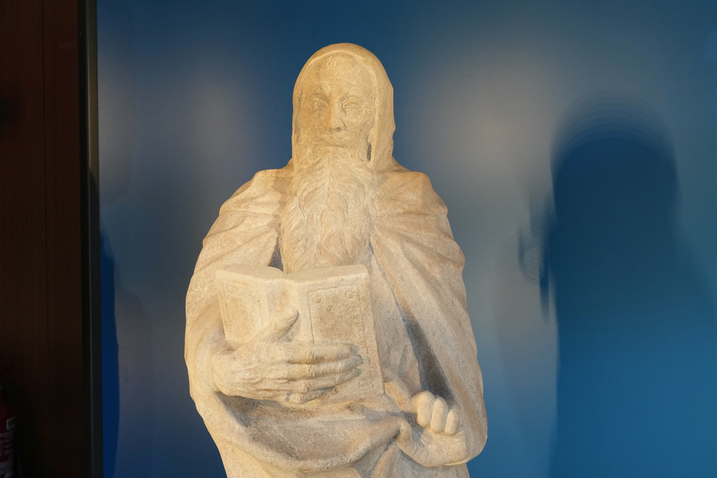 The "Bearded Saint with Book" is pictured at Milan's Cadorna station at the 2026 Winter Olympics, in Milan, Italy, Sunday, Feb. 15, 2026. (AP Photo/Antonio Calanni)