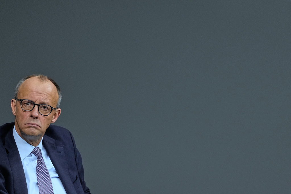 German Chancellor Friedrich Merz sits after addressing the German parliament Bundestag in Berlin, Germany, Thursday, Oct. 16, 2025. (AP Photo/Markus Schreiber)