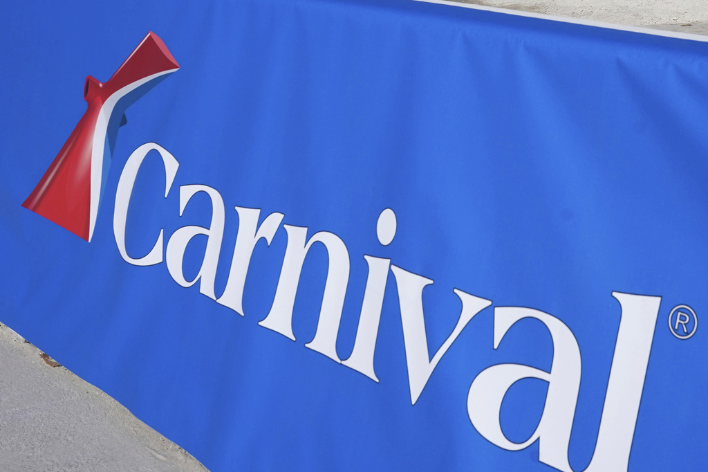 FILE - A Carnival Cruise Line sign is displayed Jan. 29, 2021, at PortMiami in Miami. (AP Photo/Lynne Sladky, File)
