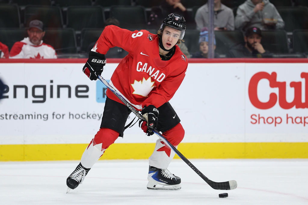 Canada forward Gavin McKenna (9) controls the puck during the second period of an IIHF World Junior Hockey Championship bronze medal game against Finland, Monday, Jan. 5, 2026, in St. Paul, Minn. (AP Photo/Matt Krohn)
