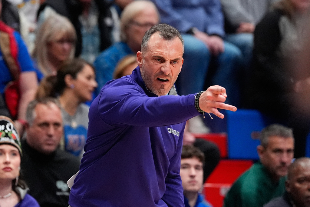 FILE - Green Bay head coach Doug Gottlieb motions to his players during the first half of an NCAA college basketball game against Kansas, Nov. 3, 2025, in Lawrence, Kan. (AP Photo/Charlie Riedel, File)