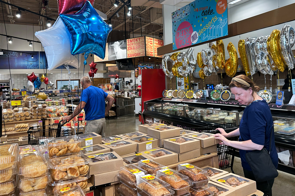 Customers shop at a grocery store in Chicago, Thursday, June 25, 2026. (AP Photo/Nam Y. Huh)