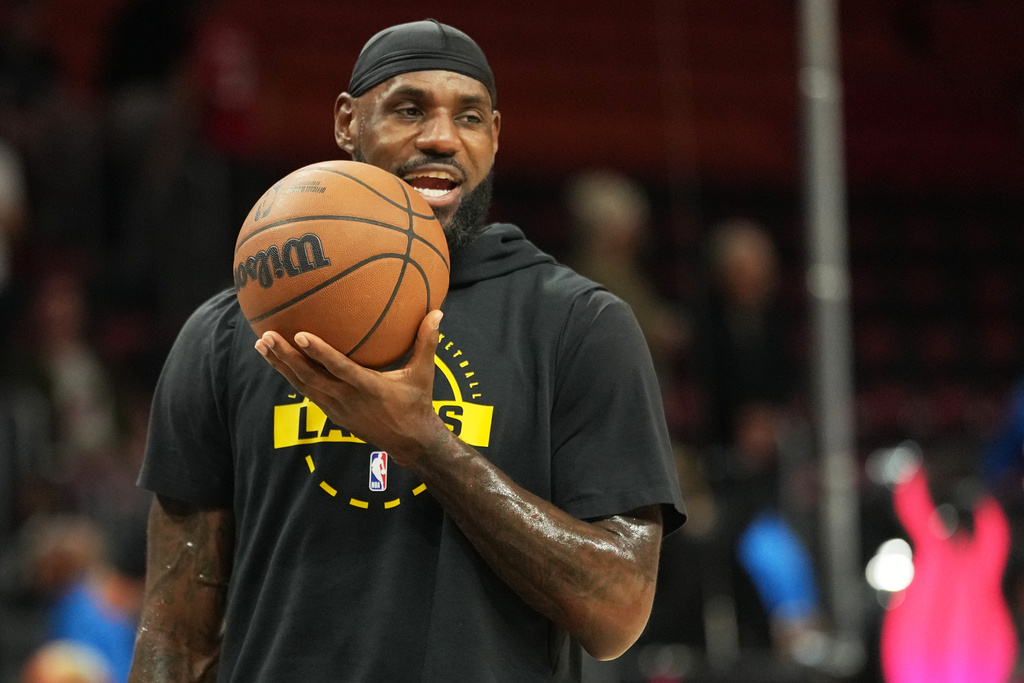 Los Angeles Lakers forward LeBron James warms up before an NBA basketball game against the Miami Heat, Thursday, March 19, 2026, in Miami. (AP Photo/Lynne Sladky)
