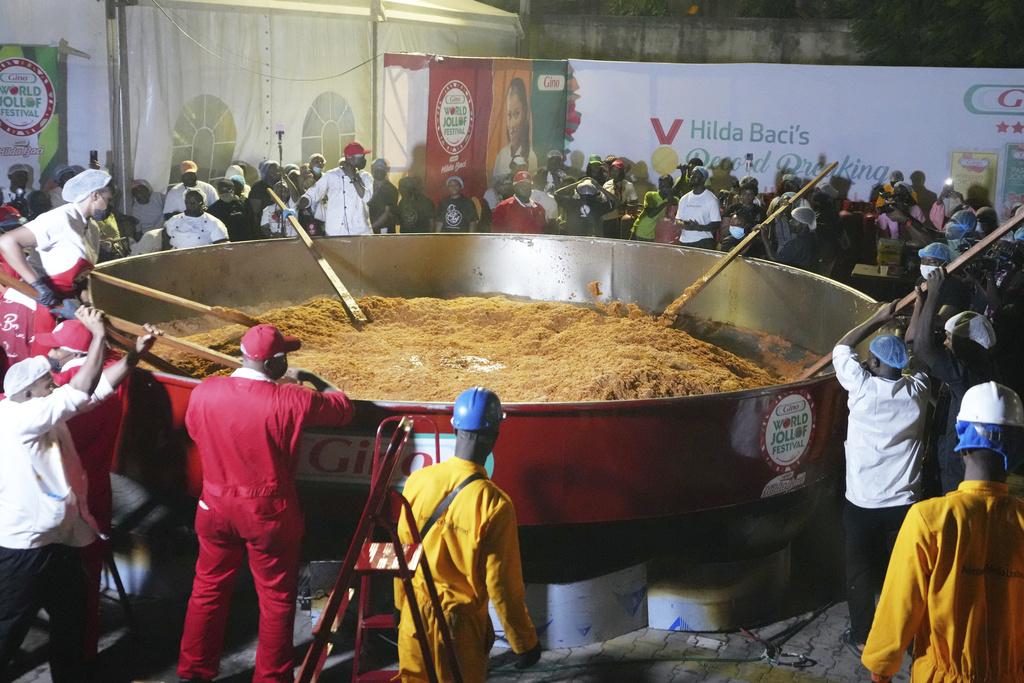 Chef Hilda Baci and her team attempt to cook the world's largest pot of Jollof Rice in Lagos, Nigeria, Friday, Sept 12, 2025. (AP Photo/Sunday Alamba)