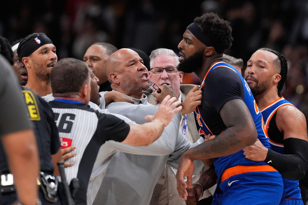 New York Knicks center Mitchell Robinson (23) and Atlanta Hawks guard Dyson Daniels (5) fight in the first half during Game 6 in a first-round NBA basketball playoffs series Thursday, April 30, 2026, in Atlanta. (AP Photo/Brynn Anderson)