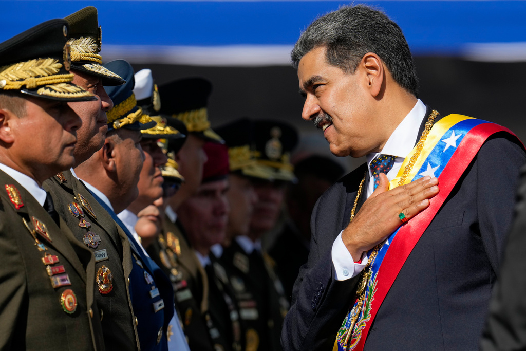 FILE - Venezuela's President Nicolas Maduro places his hand over his heart while talking to high-ranking officers during a military ceremony on his inauguration day for a third term, in Caracas, Venezuela, Jan. 10, 2025. (AP Photo/Ariana Cubillos, File)