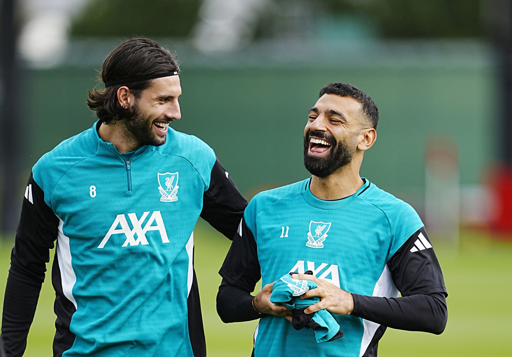 Liverpool's Dominik Szoboszlai and Mohamed Salah, right, during a training session at the AXA Training Centre, Liverpool, England, Tuesday Sept. 16, 2025. (Peter Byrne/PA via AP)