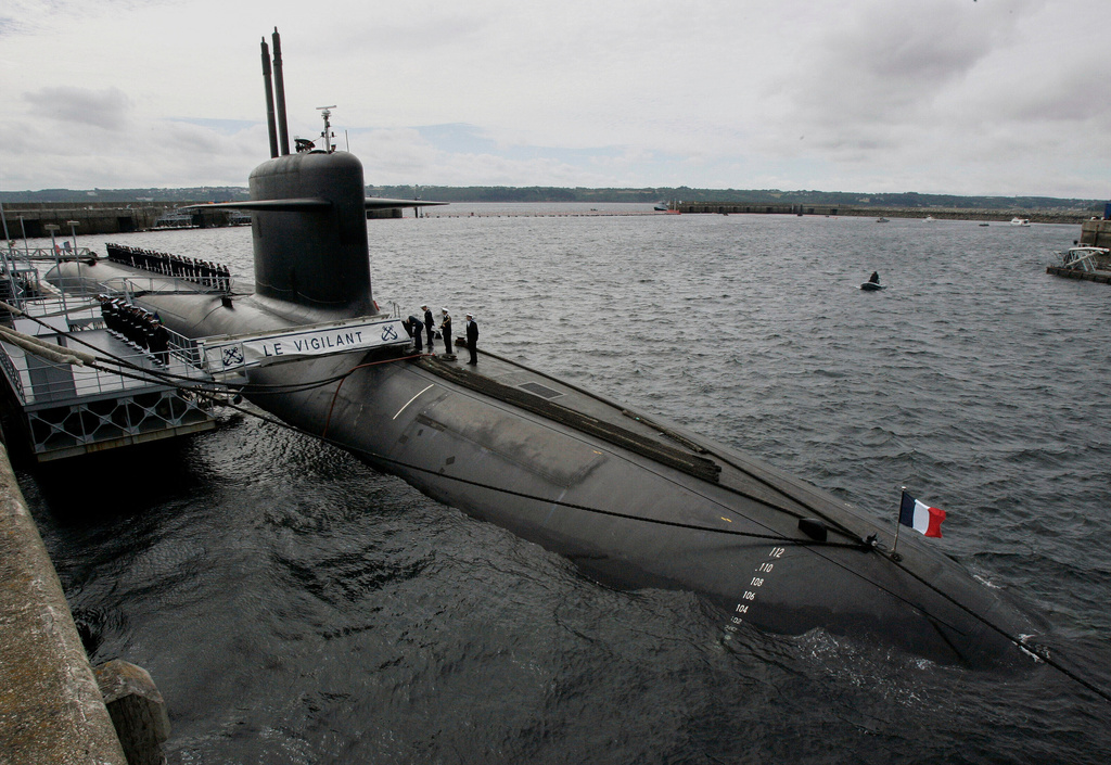 FILE - French Marine officers wait atop "Le Vigilant" nuclear submarine at L'Ile Longue military base, near Brest, Brittany, July 13, 2007. (AP Photo/Francois Mori, Pool, File)