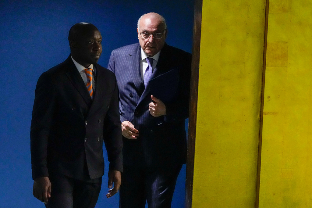 Algeria's Minister of Foreign Affairs Ahmed Attaf is escorted to the podium to address the 81st session of the United Nations General Assembly at United Nations headquarters, Monday, Sept. 28, 2026. (AP Photo/Yuki Iwamura)