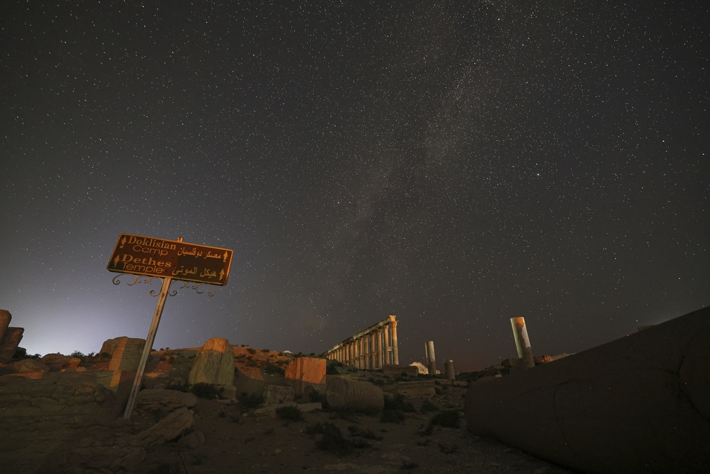 The ruins of the ancient city of Palmyra under a star-studded sky in Syria, in the early hours of Wednesday, Aug. 27, 2025.(AP Photo/Ghaith Alsayed)