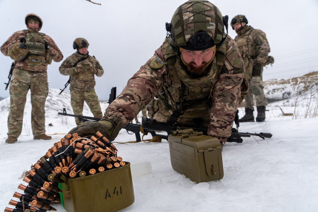 Ukrainian servicemen of special police unit take part in training at the training field in Kharkiv region, Ukraine, Friday, Feb. 13, 2026. (AP Photo/Andrii Marienko)
