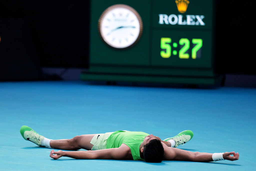 Carlos Alcaraz of Spain celebrates after defeating Alexander Zverev of Germany in their semifinal match at the Australian Open tennis championship in Melbourne, Australia, Friday, Jan. 30, 2026. (AP Photo/Asanka Brendon Ratnayake)