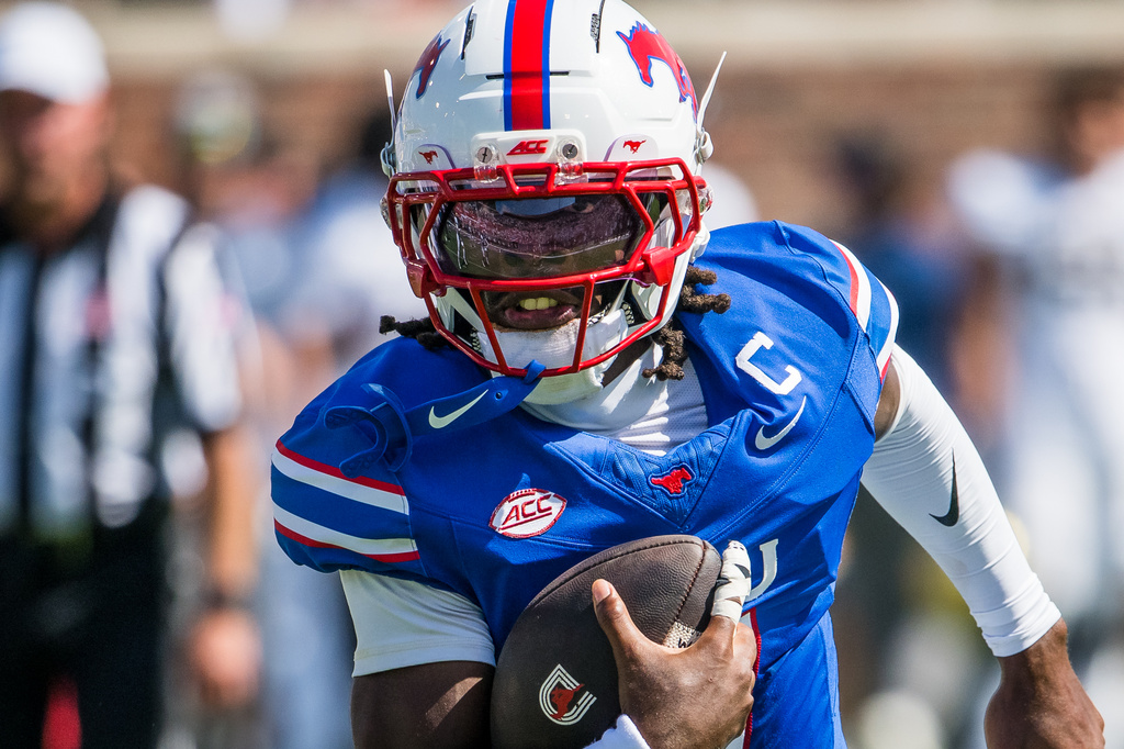 SMU's quarterback Kevin Jennings (7) runs the ball during a football game against UC Davis in Dallas, Saturday, Sept. 12, 2026. (AP Photo/Jessica Tobias)