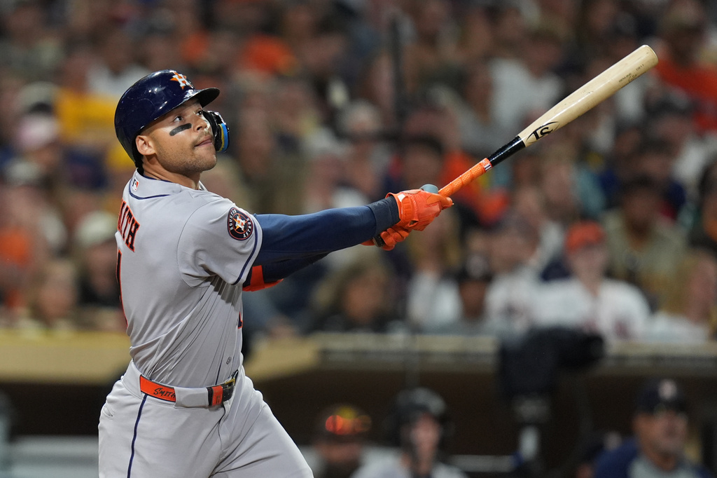 Houston Astros' Cam Smith watches his single during the eighth inning of a baseball game against the San Diego Padres Friday, Aug. 7, 2026, in San Diego. (AP Photo/Gregory Bull)