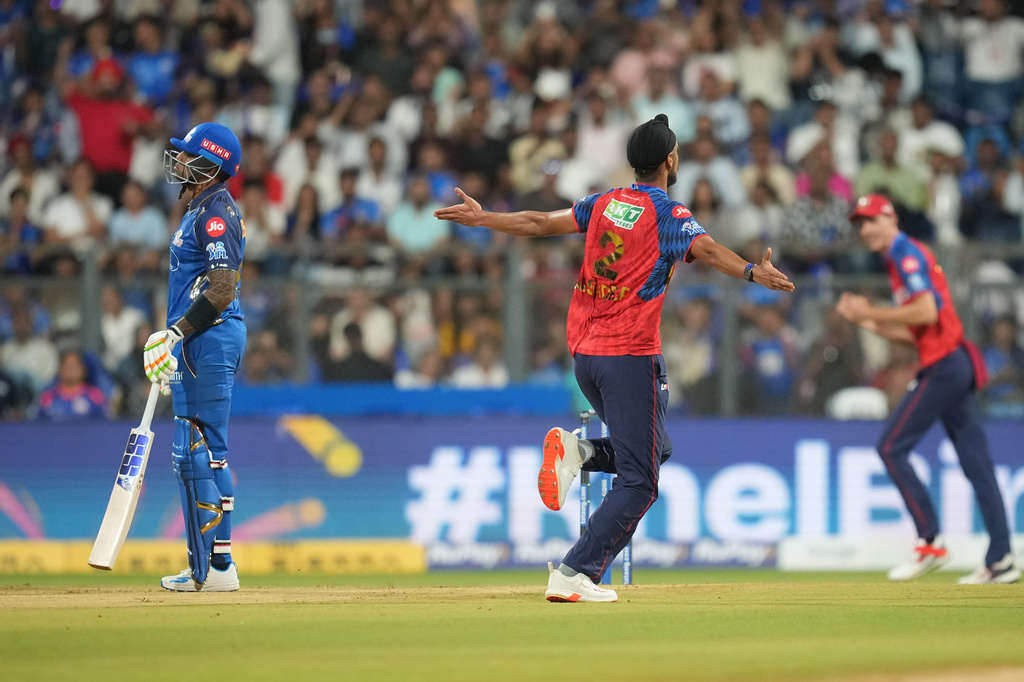 Punjab Kings' Arshdeep Singh celebrates the wicket of Mumbai Indians' Suryakumar Yadav, left, during the Indian Premier League cricket match between Mumbai Indians and Punjab Kings in Mumbai, India, Thursday, April 16, 2026. (AP Photo/Rafiq Maqbool)