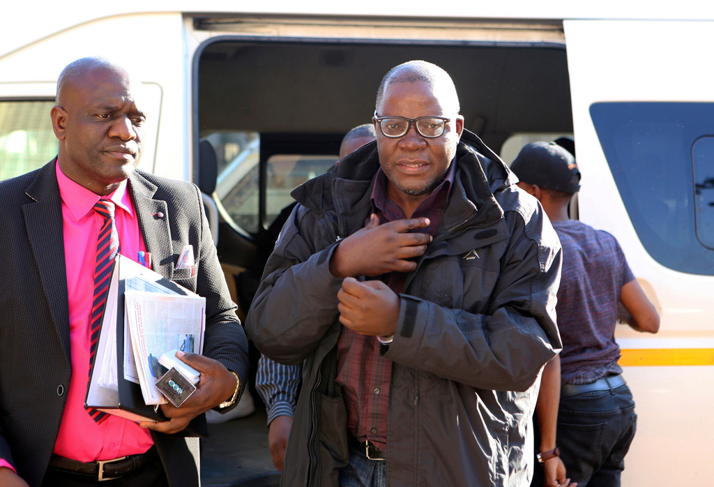 FILE - Zimbabwean opposition official Tendai Biti arrives at the magistrates courts in Harare, on Aug. 9, 2018. (AP Photo/Tsvangirayi Mukwazhi, File)