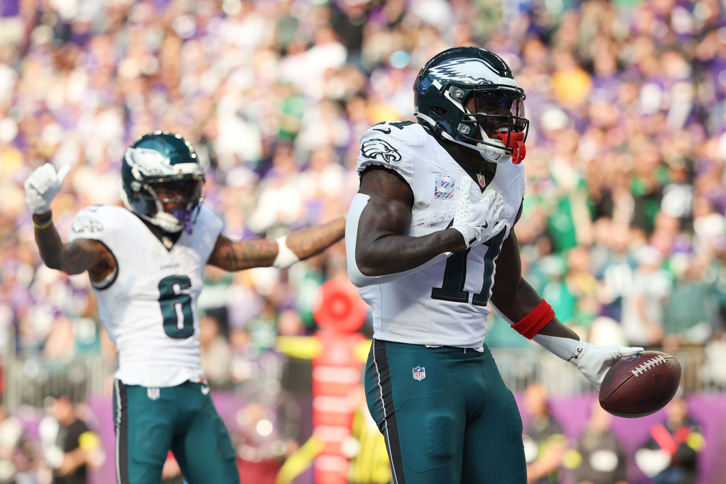 Philadelphia Eagles wide receiver A.J. Brown (11) celebrates his touchdown catch during the second half of an NFL football game against the Minnesota Vikings, Sunday, Oct. 19, 2025, in Minneapolis. (AP Photo/Ellen Schmidt)