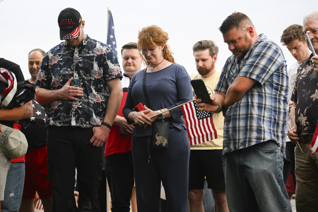 People attend a vigil at Timpanogos Regional Hospital for Charlie Kirk, the CEO and co-founder of Turning Point USA who was shot and killed, Wednesday, Sept. 10, 2025, in Orem, Utah. (AP Photo/Alex Goodlett)