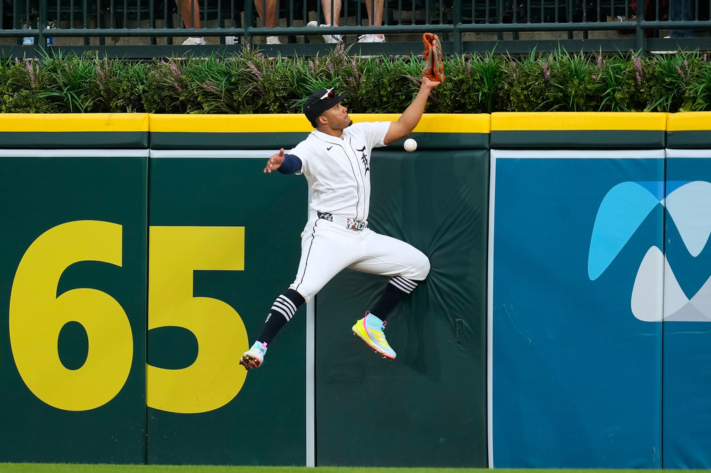 Detroit Tigers right fielder Wenceel Pérez can't catch a Cleveland Guardians' Steven Kwan fly ball during the seventh inning of a baseball game Tuesday, May 19, 2026, in Detroit. (AP Photo/Paul Sancya)