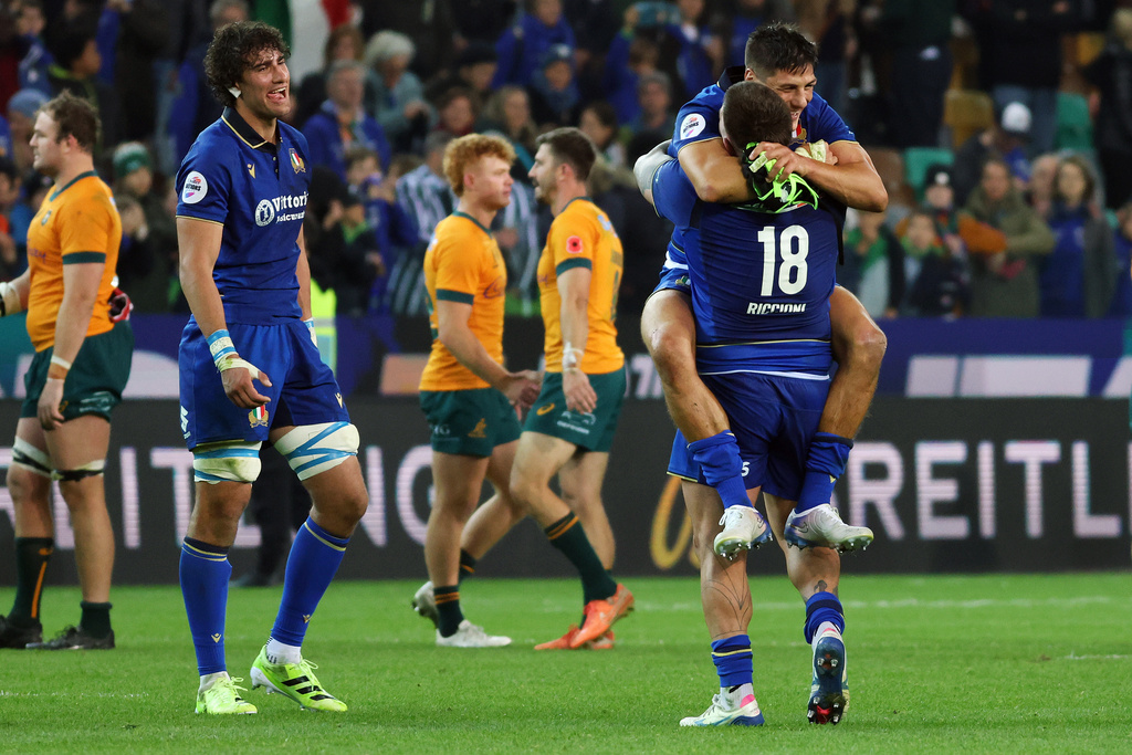 Italian players celebrate after winning the rugby union match between Italy and Australia in Udine, Italy, Saturday, Nov. 8, 2025. (Andrea Bressanutti/LaPresse via AP)