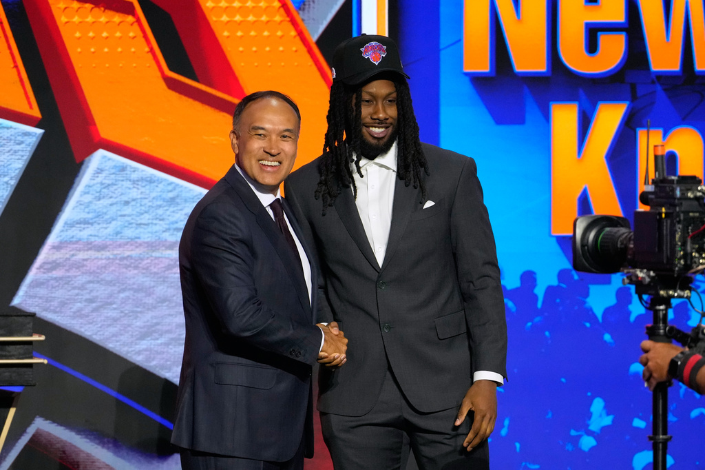 Bruce Thornton poses for a photo with NBA Deputy Commissioner Mark Tatum after being selected by the New York Knicks in the second round of the NBA basketball draft Wednesday, June 24, 2026, in New York. (AP Photo/Yuki Iwamura)