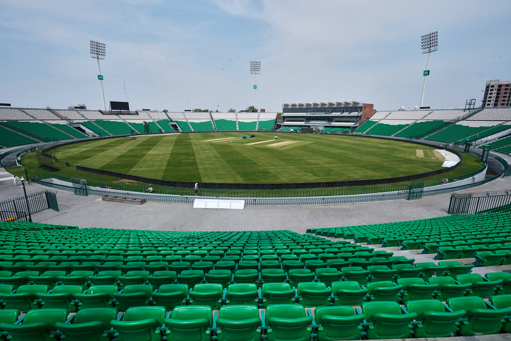 Groundsmen work at the at the Gaddafi Stadium in preparations for upcoming Pakistan's premier domestic T20 the Pakistan Super League, which will take place in empty stadiums due to the recent spike in oil prices, in Lahore, Pakistan, Tuesday, March 24, 2026. (AP Photo/K.M. Chaudary)