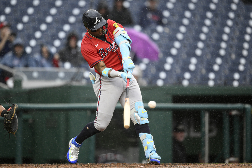 Atlanta Braves' Ronald Acuña Jr. singles during the ninth inning of the first baseball game of a doubleheader against the Washington Nationals, Tuesday, Sept. 16, 2025, in Washington. (AP Photo/Nick Wass)
